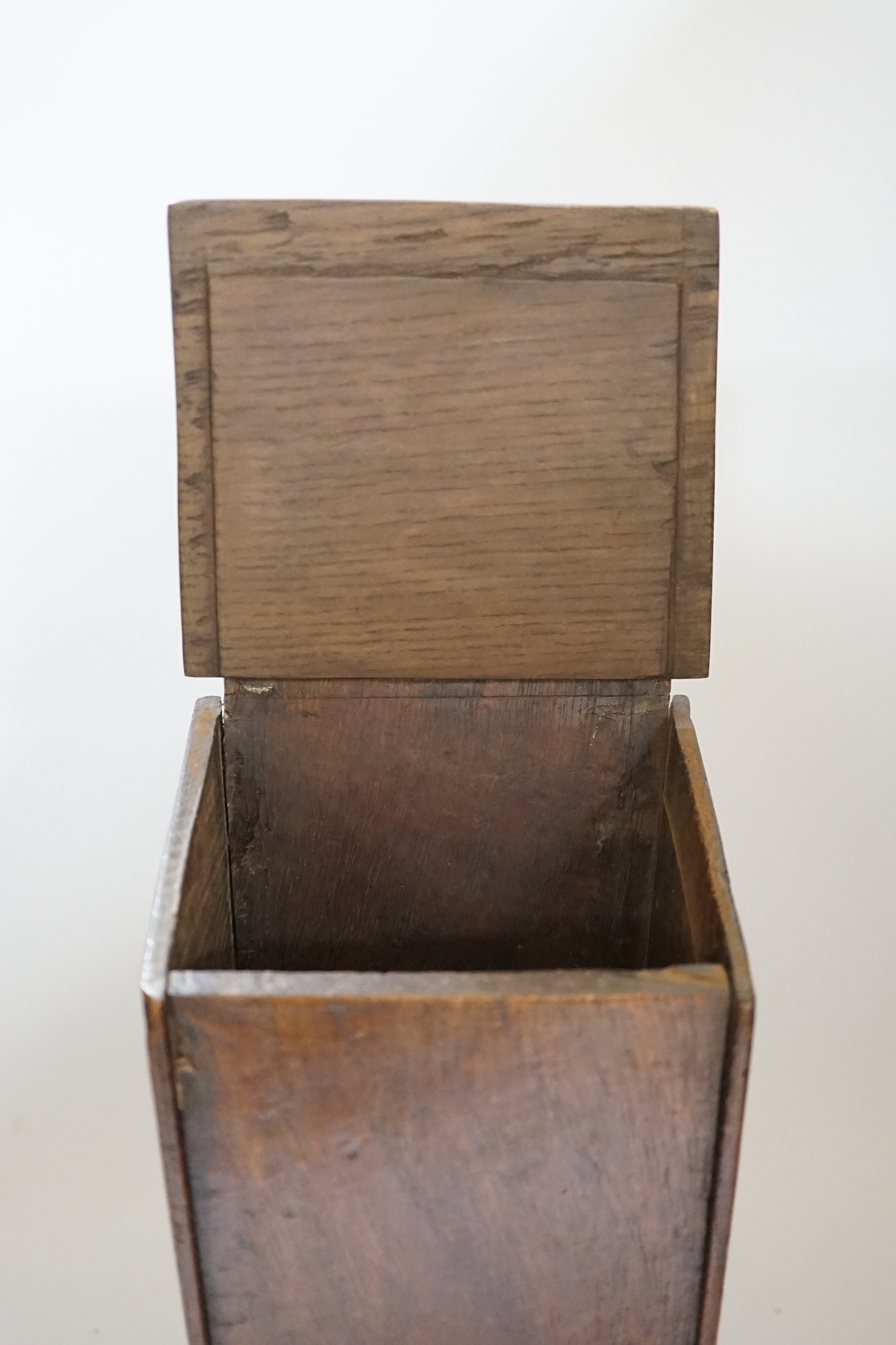 A 18th / 19th century oak candle box, 38cm high